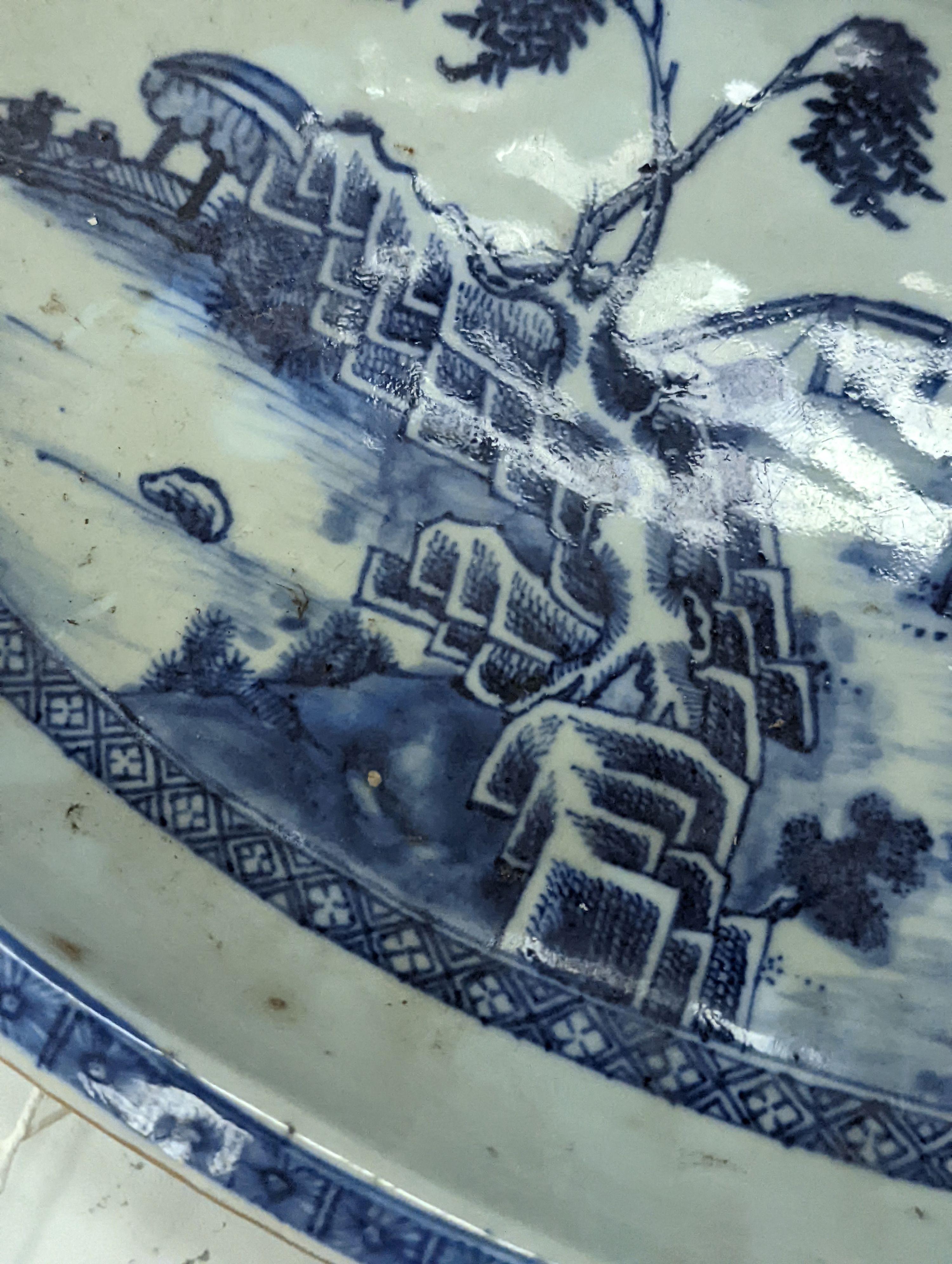 An 18th century Chinese export oval blue and white dish, 32cm.